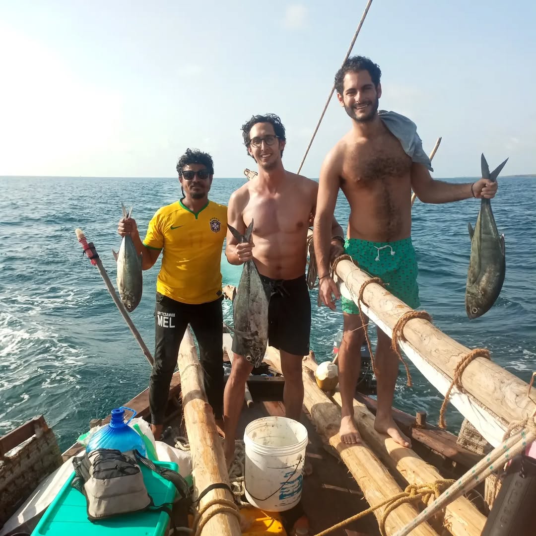 Local fisherman on traditional dhow demonstrating ancestral techniques